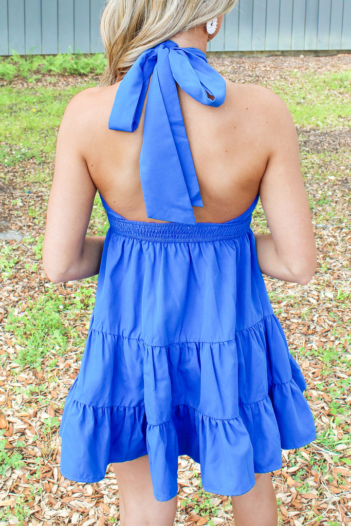 royal blue tiered dress with criss cross halter neck