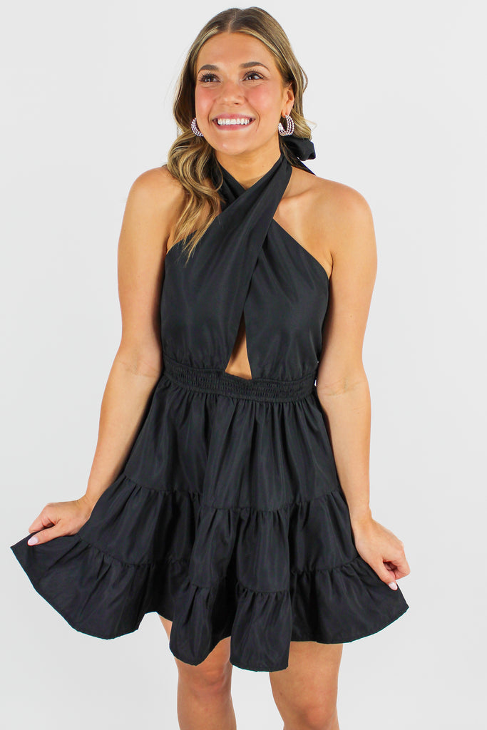 black tiered dress with criss cross halter neck