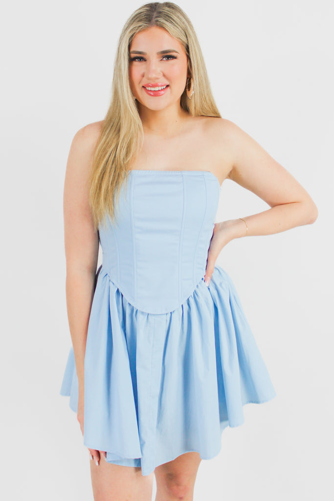 light blue corset dress with a fitted top and a flowy bottom.