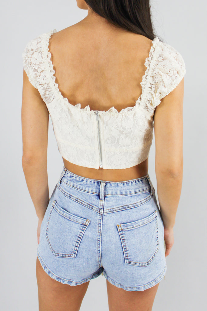 cream colored crop top with floral lace detail