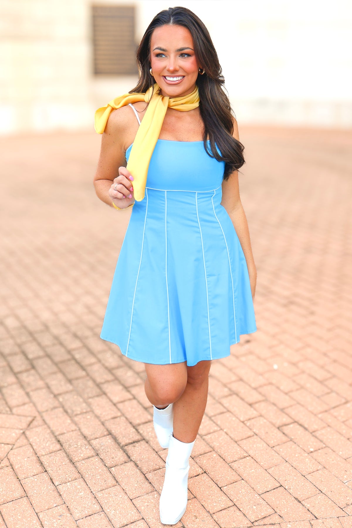 Blue open back mini dress with faux leather trim