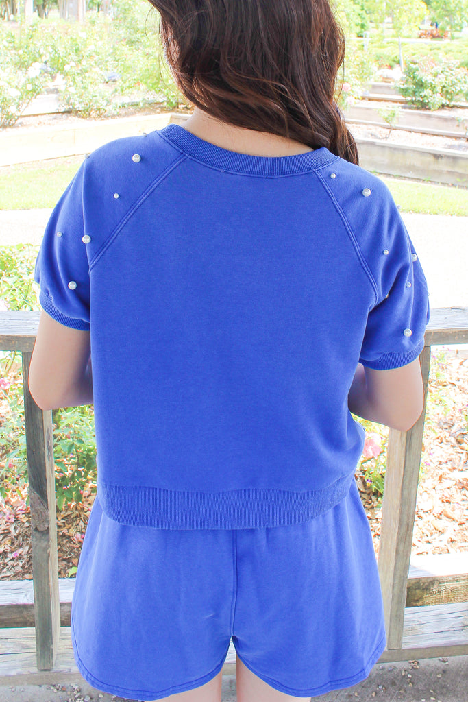 royal blue short sleeve top with pearl embellished detailing