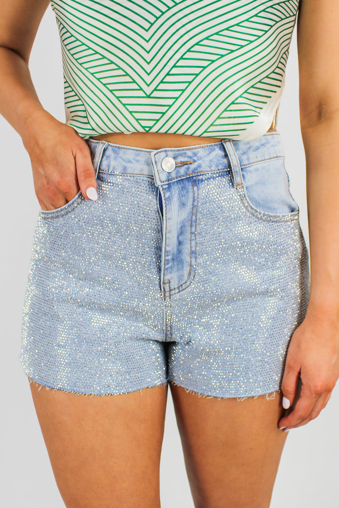 front view of rhinestone covered light denim shorts 
