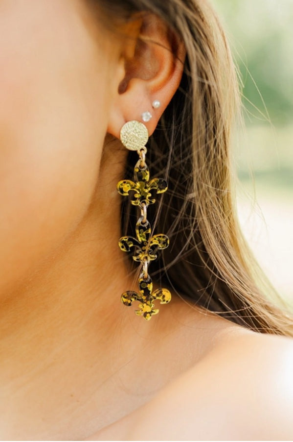 Confetti Fleur De Lis Earrings by Taylor Shaye in Black/Gold worn