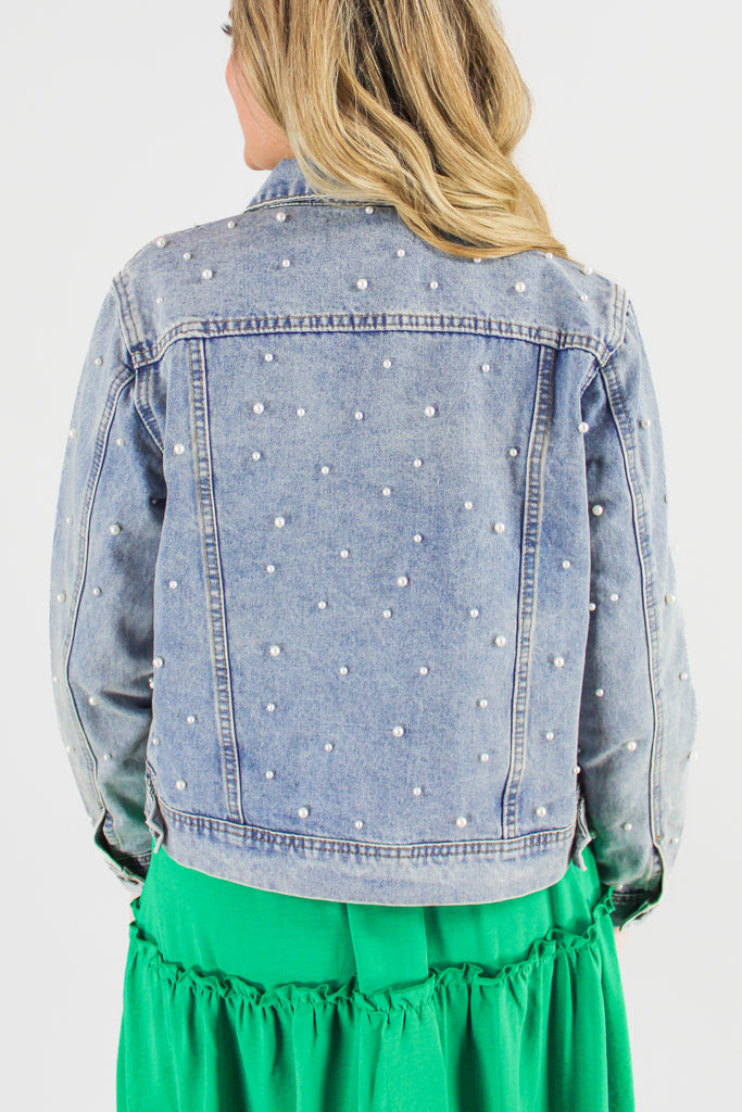 Back view of denim jacket with pearls