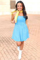 Blue open back mini dress with faux leather trim