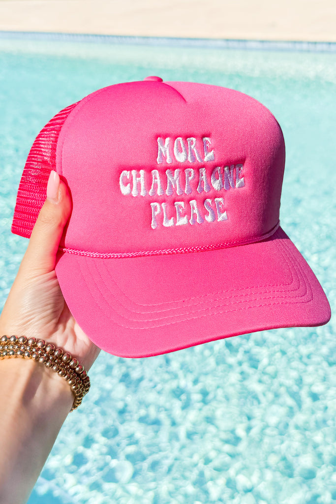 hot pink snapback trucker hat with embroidered lettering that reads more champagne please