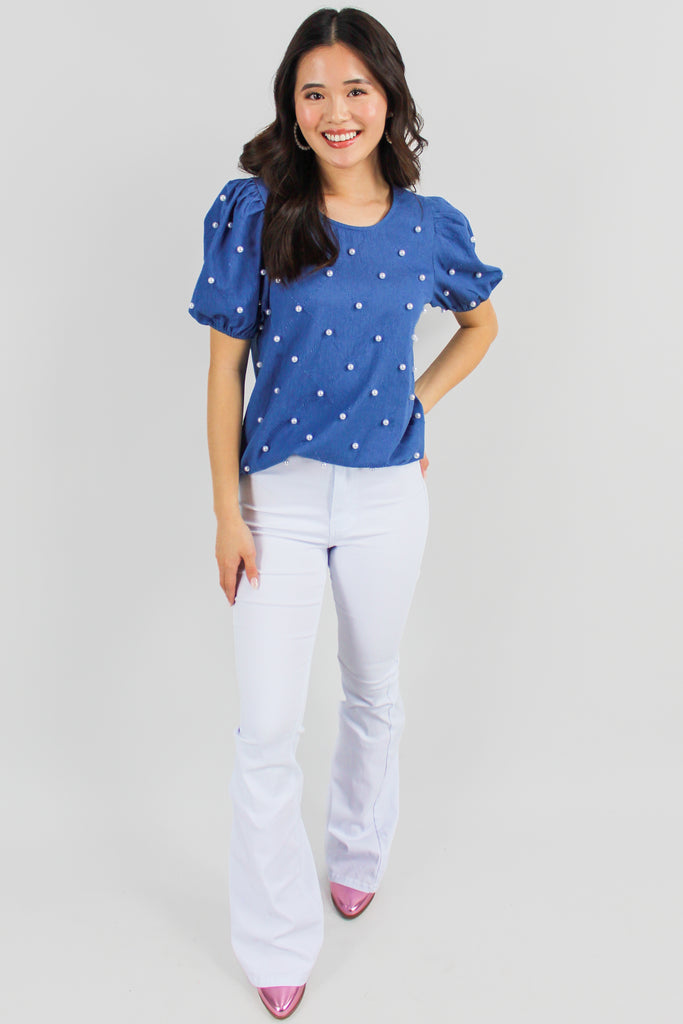 medium denim puff sleeve top with pearl embellishments throughout