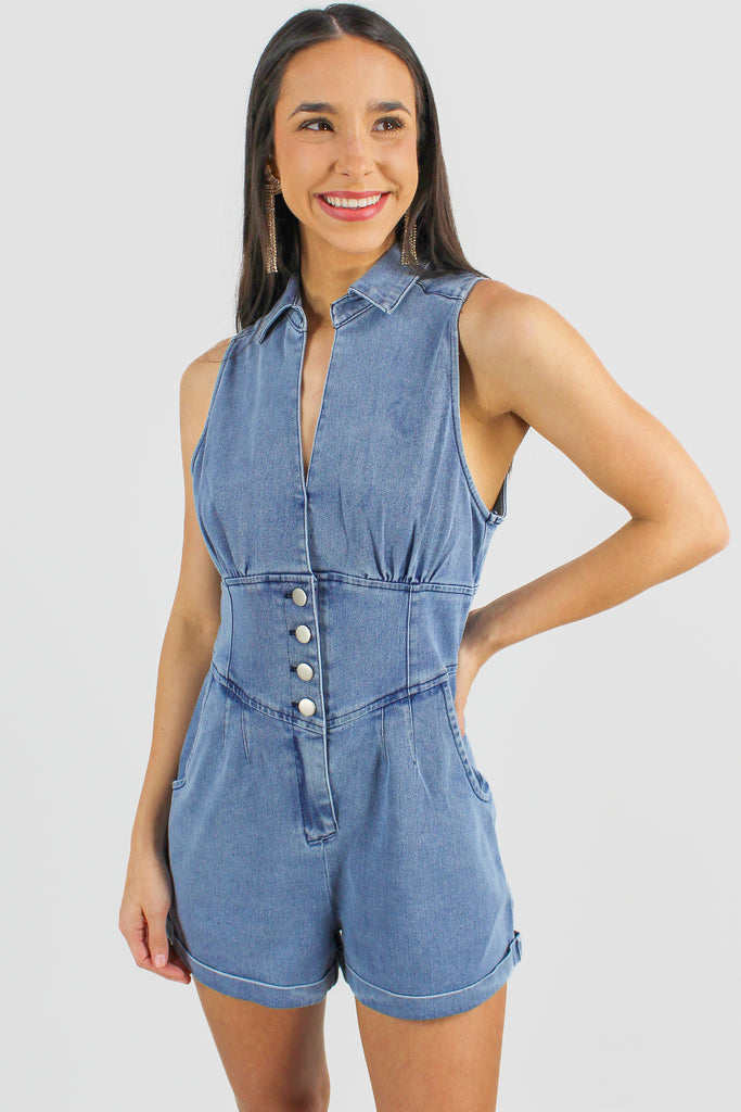 collared denim romper with a cuffed hem and 4 buttons in the front