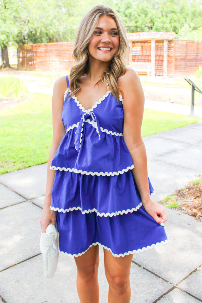 blue tiered dress with white trim details