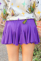 Purple tiered ruffle mini skirt with smocked waist, back view