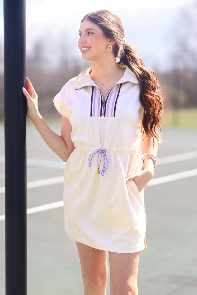 ecru drawstring waist dress with purple and navy stripes