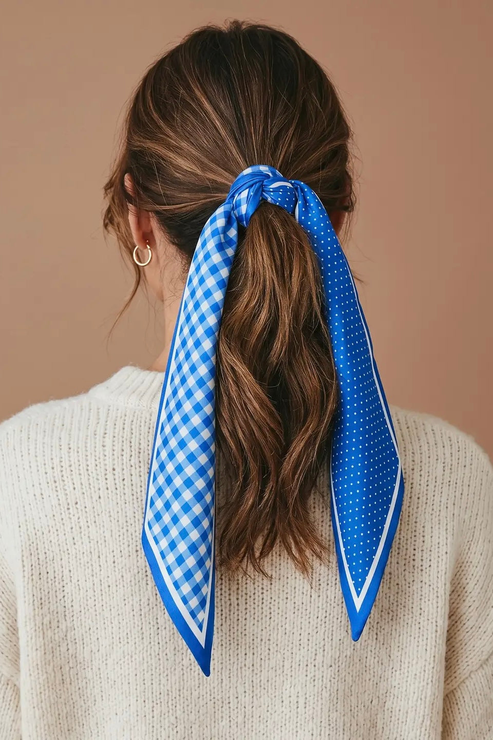 Blue gingham polka dot twilly scarf tied in a ponytail