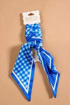 Blue gingham polka dot twilly scarf on its packaging card