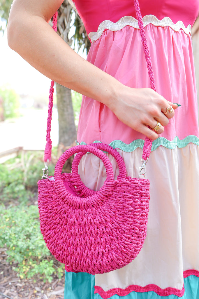 rose pink woven straw crossbody