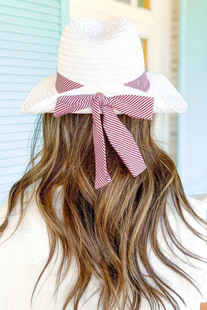 red and white striped ribbon detailed white straw hat