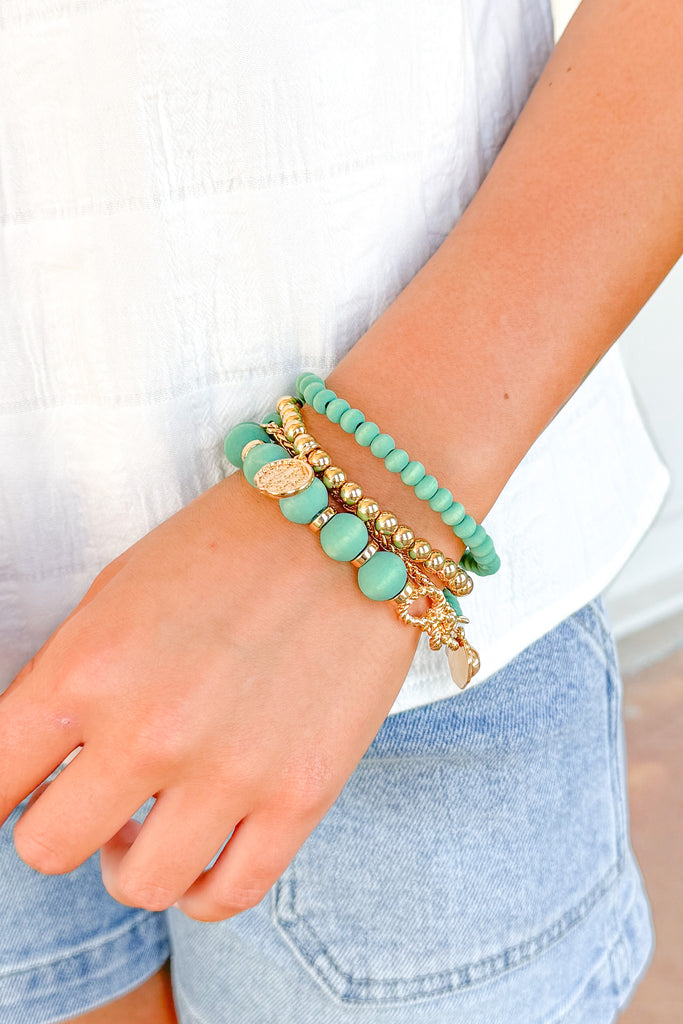 wooden bead bracelet set in mint with gold details