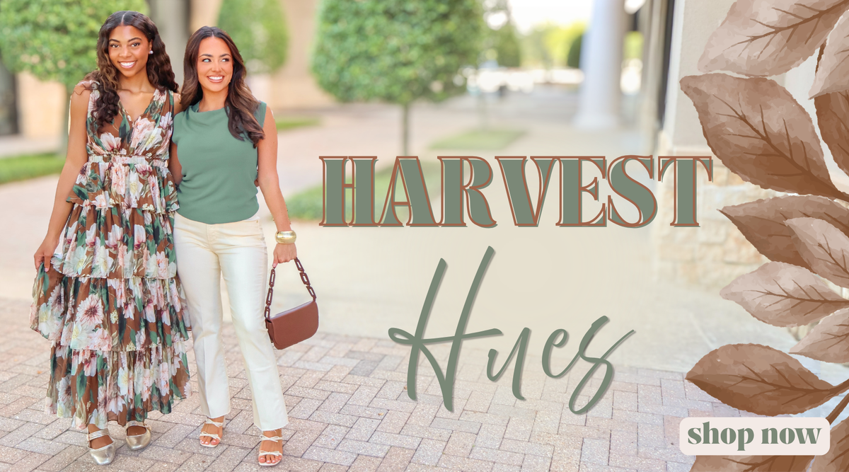 Two women walking outdoors on a paved walkway, with large overlaid text reading 'HARVEST Hues' and a 'shop now' badge. The scene includes trees and a building in the background, so this is Lifestyle rather than Product/Packaging.