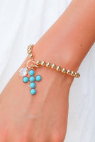 rhinestone and cross bracelet