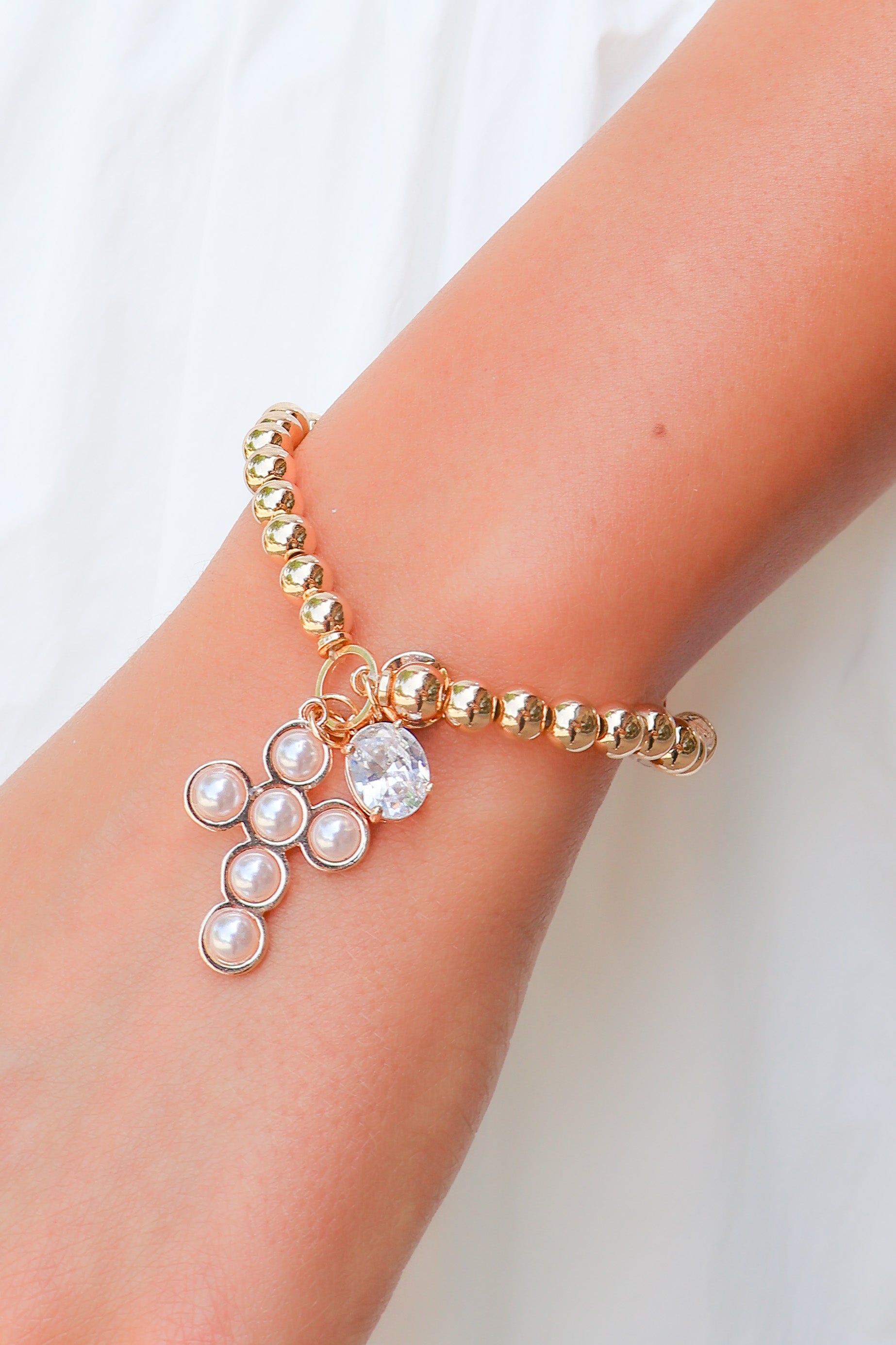 rhinestone and cross bracelet
