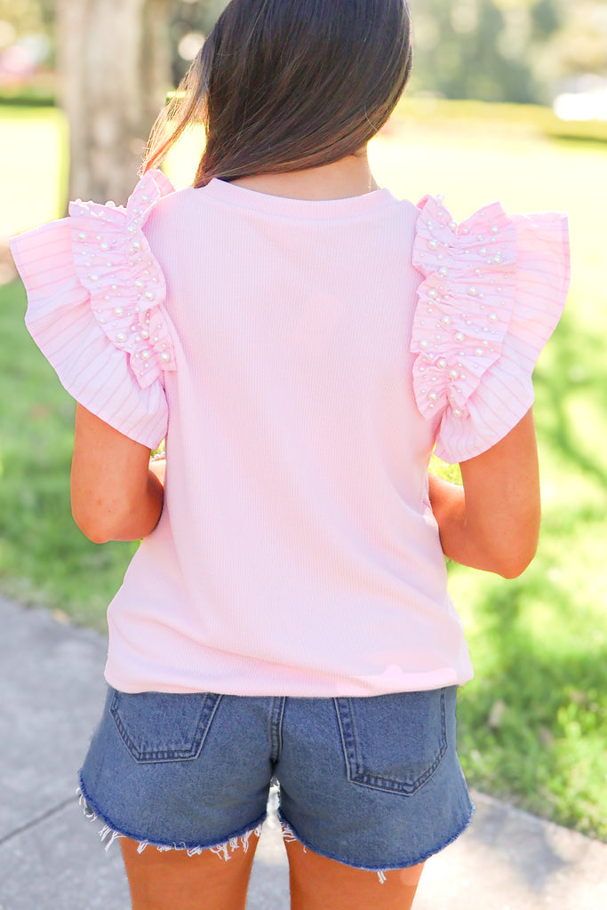 back of light pink pearl detail ruffle sleeve top