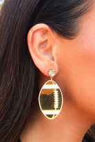 Gold football earrings with rhinestone top
