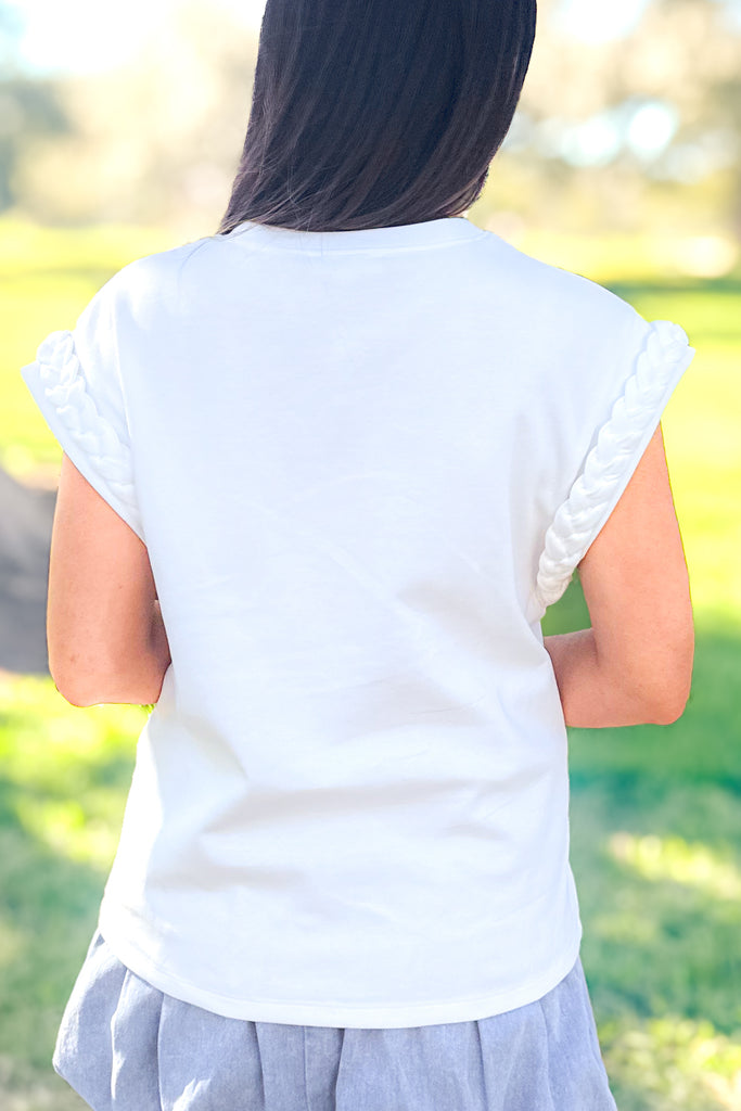 back of braided sleeve white tee