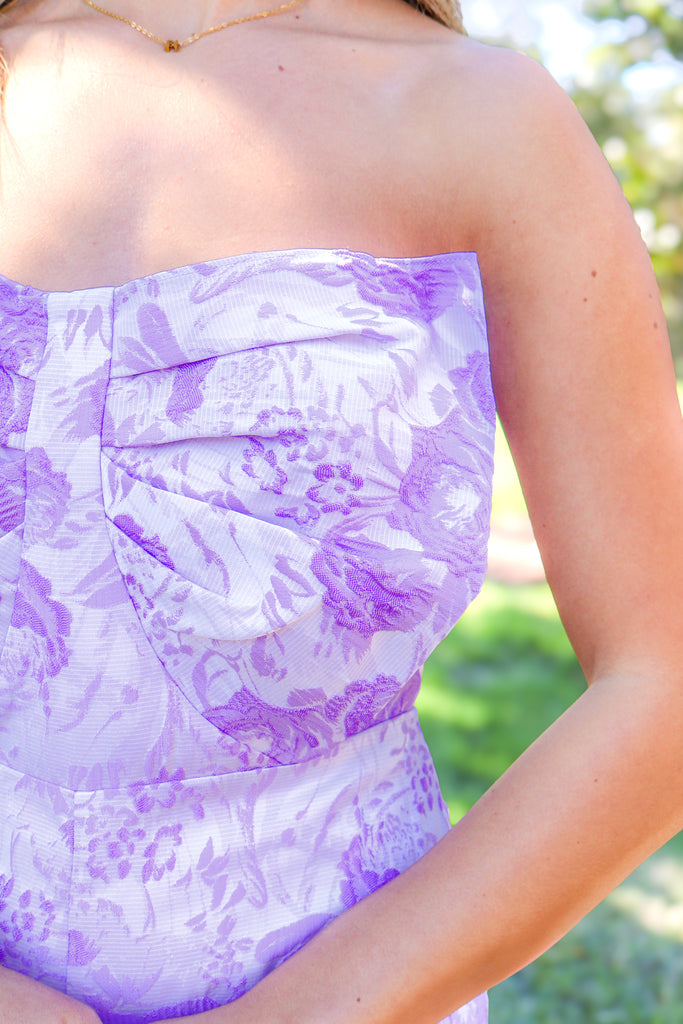 up close of bow on floral lavender romper