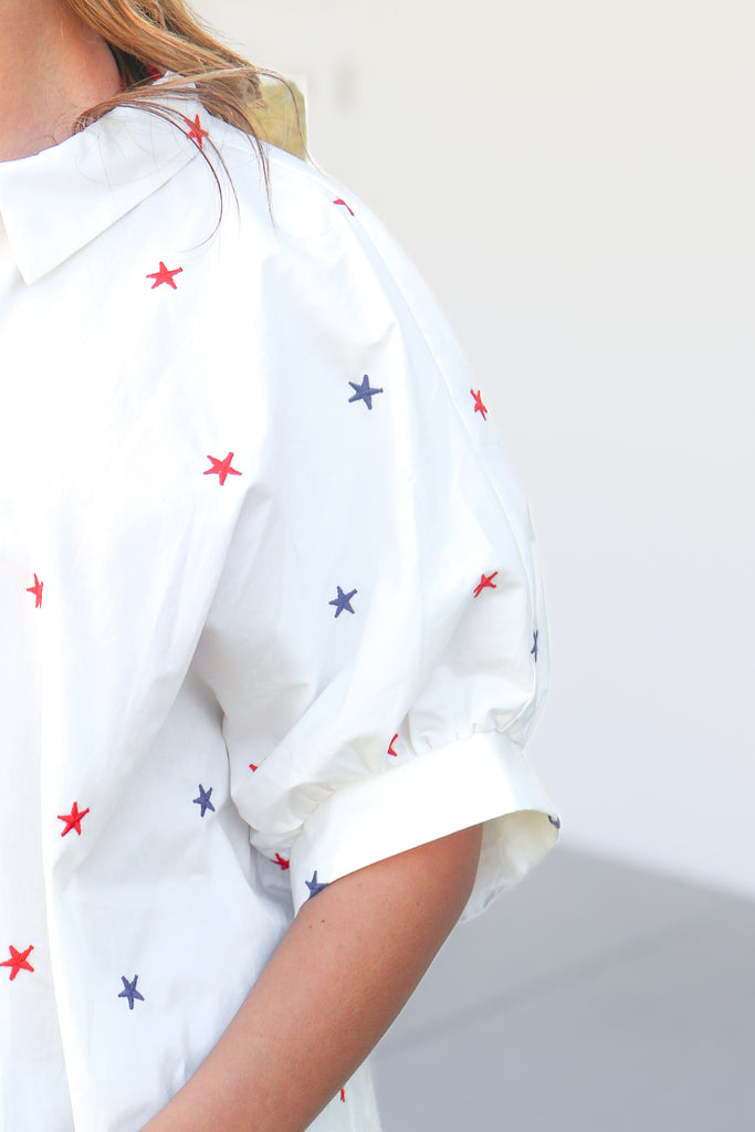 sleeve of oversized button down star top