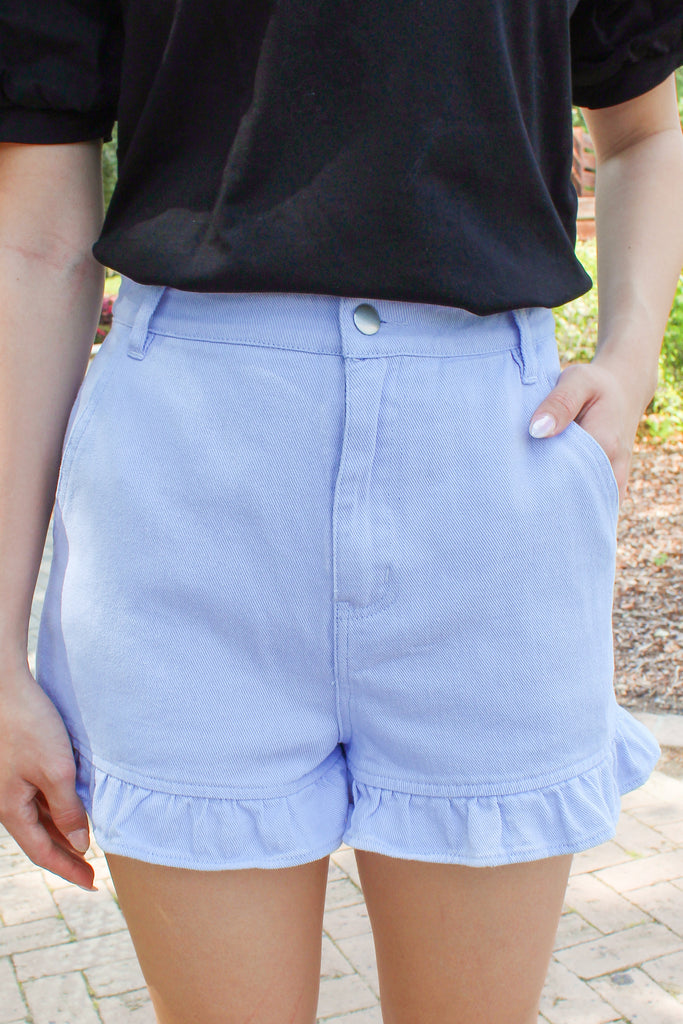 light blue denim ruffle hem shorts