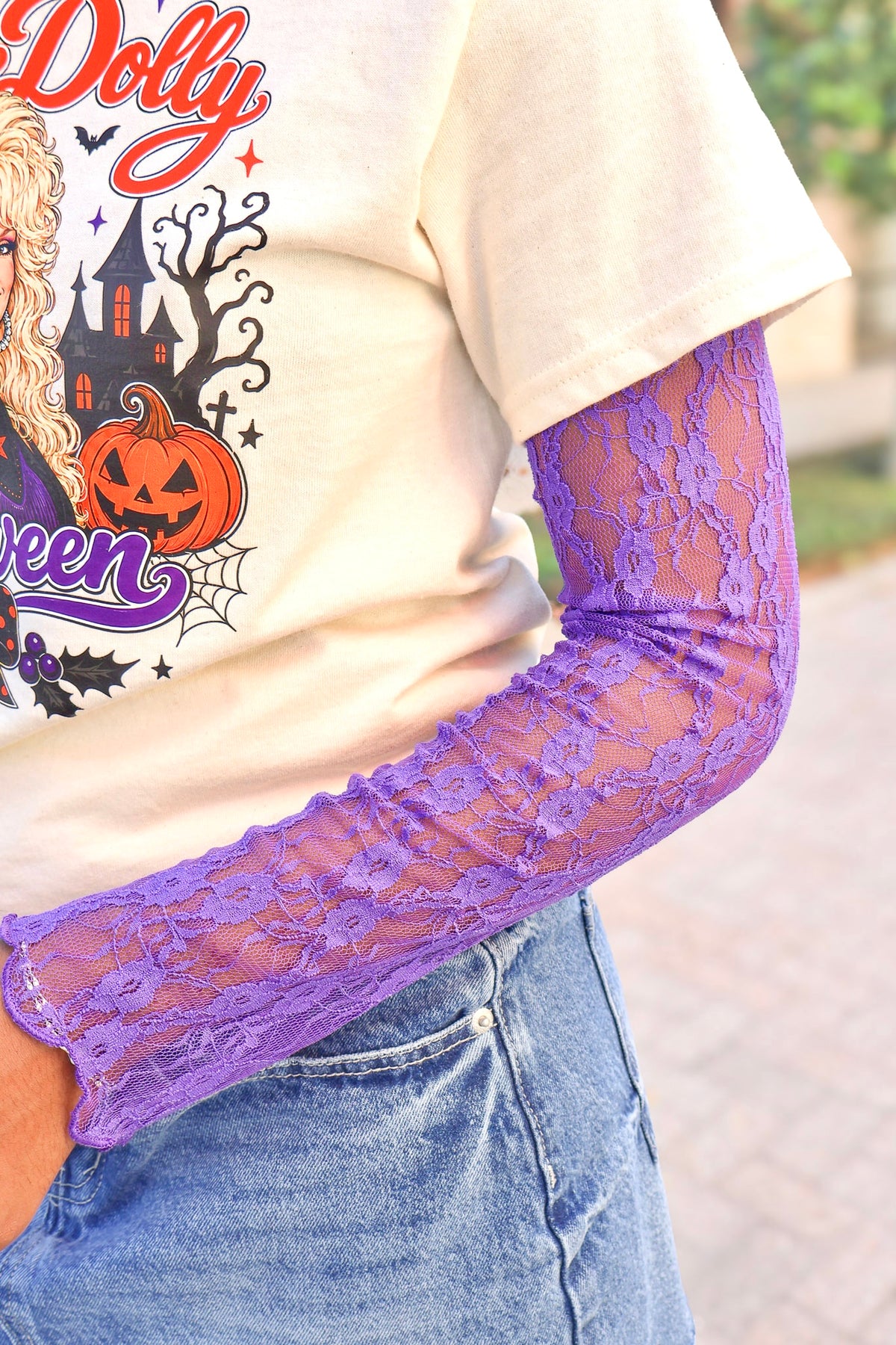 Stay for Awhile High Neck Lace Mesh Top in Purple layered under a graphic tee
