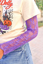 Stay for Awhile High Neck Lace Mesh Top in Purple layered under a graphic tee