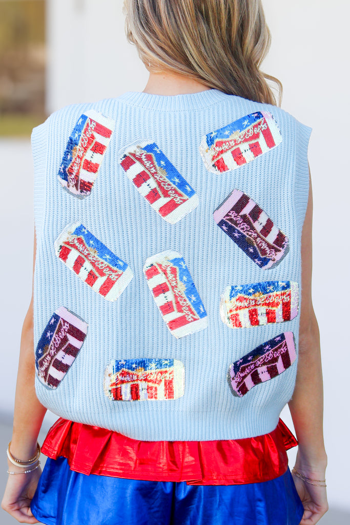 back of red white and brew sweater vest in light blue