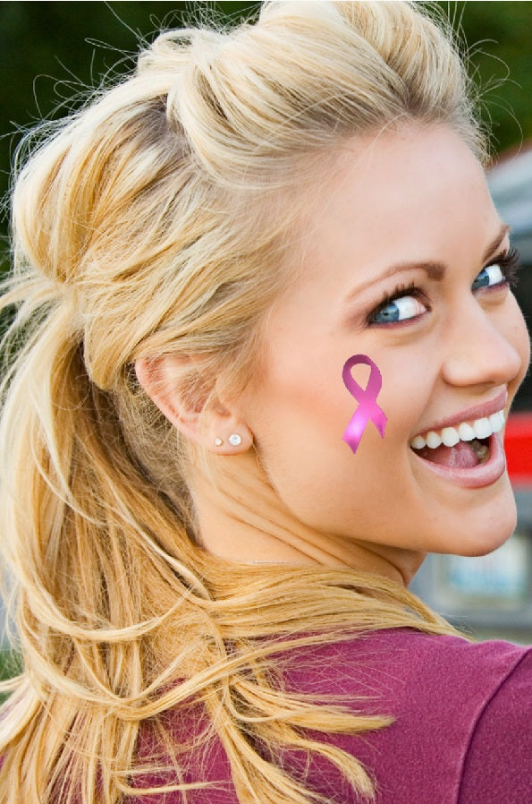 Pink ribbon metallic tattoo worn on the cheek