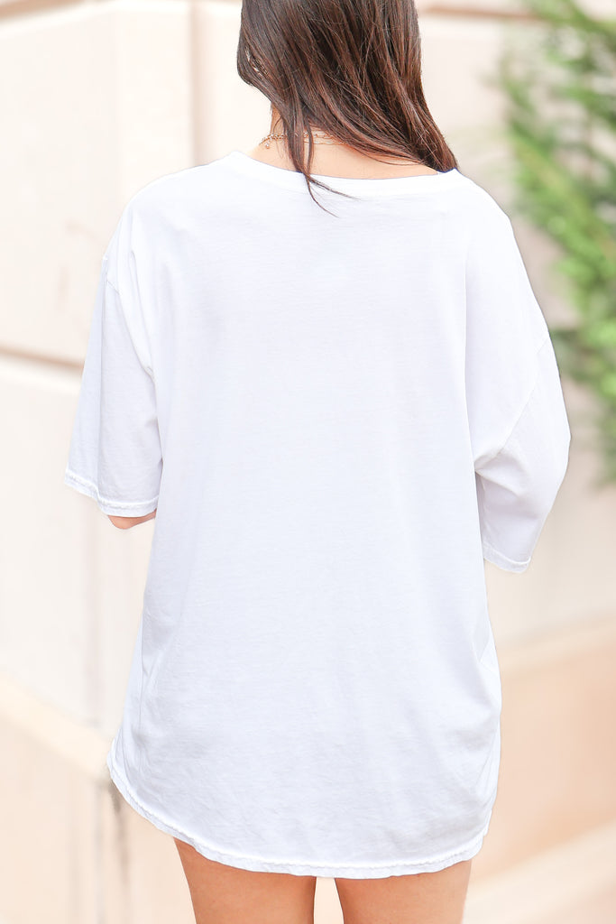 back of white graphic tee