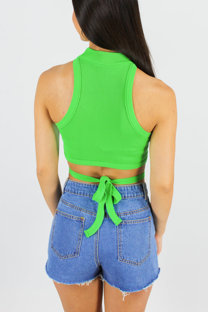 Back view of lime green ribbed, sleeveless, mock neck tank with tie in the back